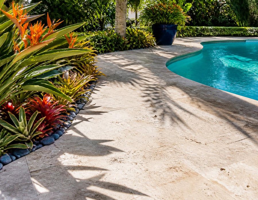 Travertine pool deck with tropical planting